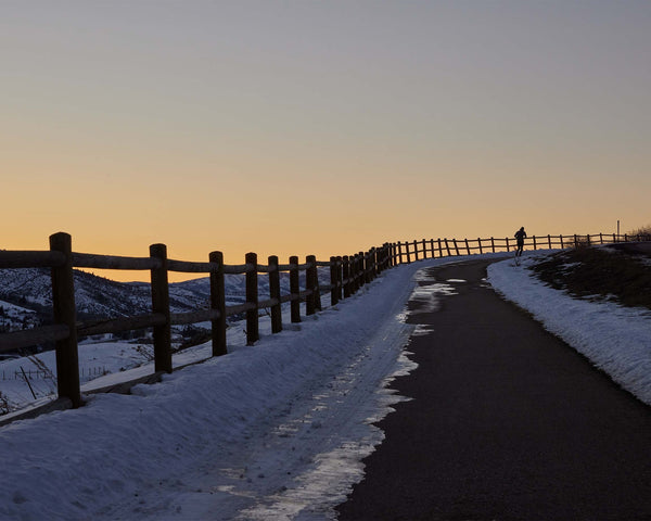 Runner on Winding Road At Sunset