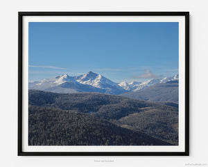 This black and white fine art photography print shows winter at Vail Ski Resort in Colorado's Rocky Mountains. At Vail Ski Resort, just a few steps away from the Eagle Bahn Gondola is an overlook. In the distance, the summit of the Mount of the Holy Cross is covered in snow.