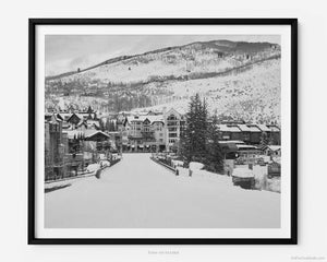 This black and white fine art photography print is of Vail Ski Resort in Vail, Colorado. This image captures the majestic beauty of Lionshead Village during the winter ski season, showcasing the town's picturesque charm and natural splendor.