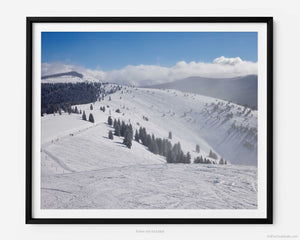This fine art photography print shows winter in Vail, Colorado at Vail Ski Resort. The wide view of the Back Bowls includes ski runs such as: Sleepy Time Road, Headwall, Yonder Gulley, Yonder, and the Sun Up Express Ski Lift.