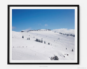 This fine art photography print shows winter in Vail, Colorado at Vail Ski Resort. This view of the Back Bowls from Two Elk Lodge includes ski runs and the Orient Express Ski Lift in the distance.