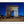 Load image into Gallery viewer, This Paris photography print is a timeless summer night scene of the Arc de Triomphe in Paris, France. This long exposure photo, shows cars swirling around the centre of Place Charles de Gaulle, standing at the western end of the Champs-Élysées. The summer night lends itself to showcase this Neoclassical monument against the crystal blue night sky. 
