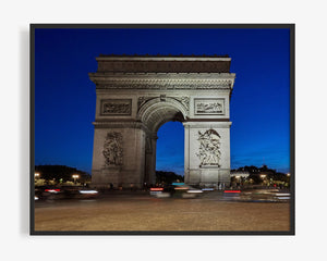 This Paris photography print is a timeless summer night scene of the Arc de Triomphe in Paris, France. This long exposure photo, shows cars swirling around the centre of Place Charles de Gaulle, standing at the western end of the Champs-Élysées. The summer night lends itself to showcase this Neoclassical monument against the crystal blue night sky. 
