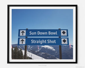 This fine art photography print shows winter in Vail, Colorado at Vail Ski Resort. Signage marks the entrance to expert black diamond ski runs like Sun Down Bowl and Straight Shot as well as the Back Bowl.