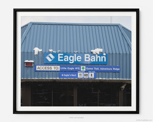 This fine art photography print shows winter in Vail, Colorado at Vail Ski Resort. The iconic Eagle Bahn Gondola, covered in some light snow, lists access to Little Edge #15, Game Trail, Adventure Ridge, and Eagle’s Nest.