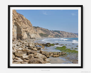 This fine art photography print shows the natural rock formations facing the Pacific Ocean from Black's Beach at Torrey Pines National Reserve in San Diego, California. Miles of pristine beach stretch out into the distance. 