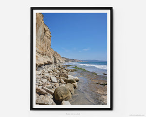 This fine art photography print shows the natural rock formations facing the Pacific Ocean from Black's Beach at Torrey Pines National Reserve in San Diego, California. Miles of pristine beach stretch out into the distance. 